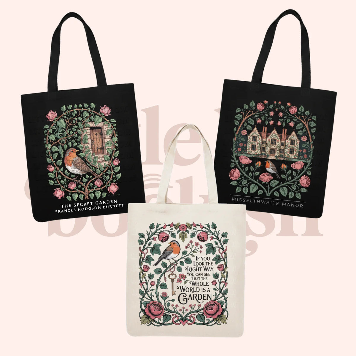 Three decorative canvas tote bags shown on a pale pink background: two black bags with illustrated garden and house designs, and one cream bag with a floral and bird circular design and text reading 'The Secret Garden' and 'Misselthwaite Manor.'.