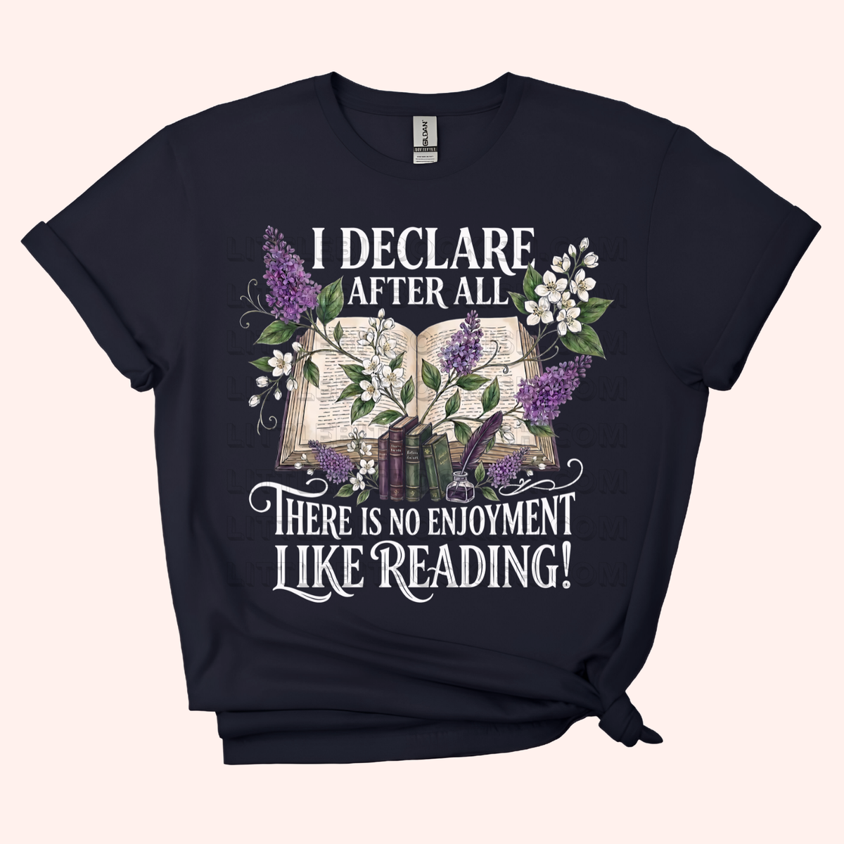 Black unisex t-shirt with a floral and stacked books design, featuring the text "I declare after all there is no enjoyment like reading" in large white letters — Pride & Prejudice quote t-shirt by Little Bit Bookish.