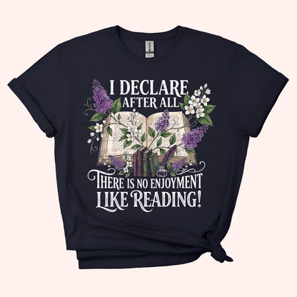 Black unisex t-shirt with a floral and stacked books design, featuring the text "I declare after all there is no enjoyment like reading" in large white letters — Pride & Prejudice quote t-shirt by Little Bit Bookish.
