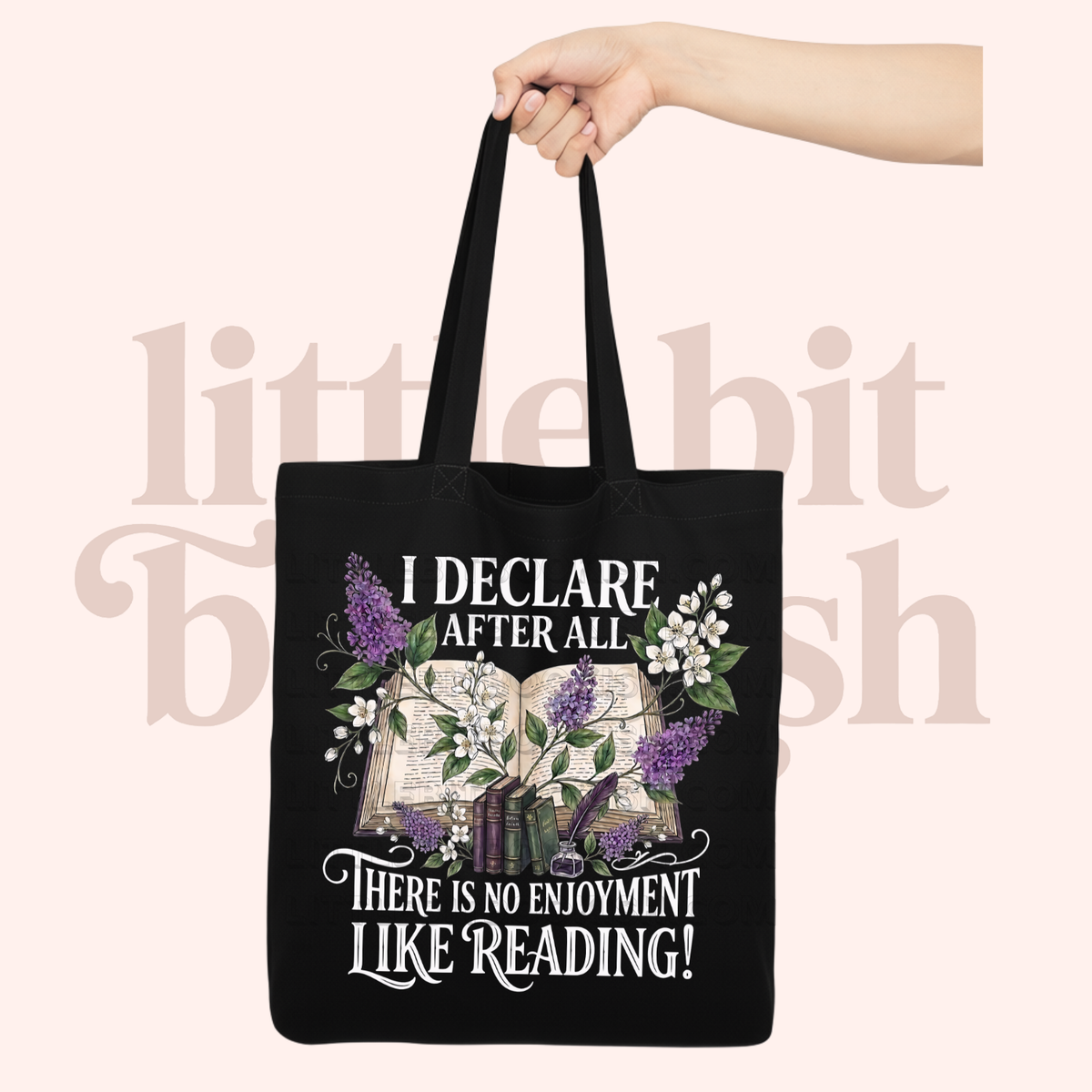 Black canvas tote bag with a floral and stacked books design, featuring the text "I declare after all there is no enjoyment like reading" in large white letters — Pride & Prejudice quote tote bag by Little Bit Bookish.